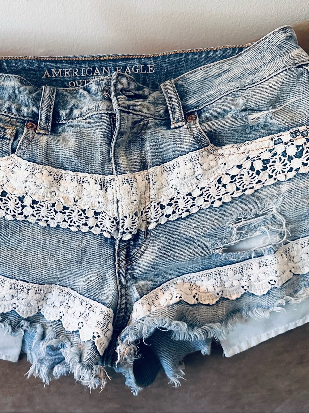 American Eagle Outfitters Light Blue Denim Shorts with White Lace Trim. Boho